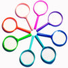 A collection of colorful plastic magnifying glasses with pink, purple, orange, and blue frames and white lenses.