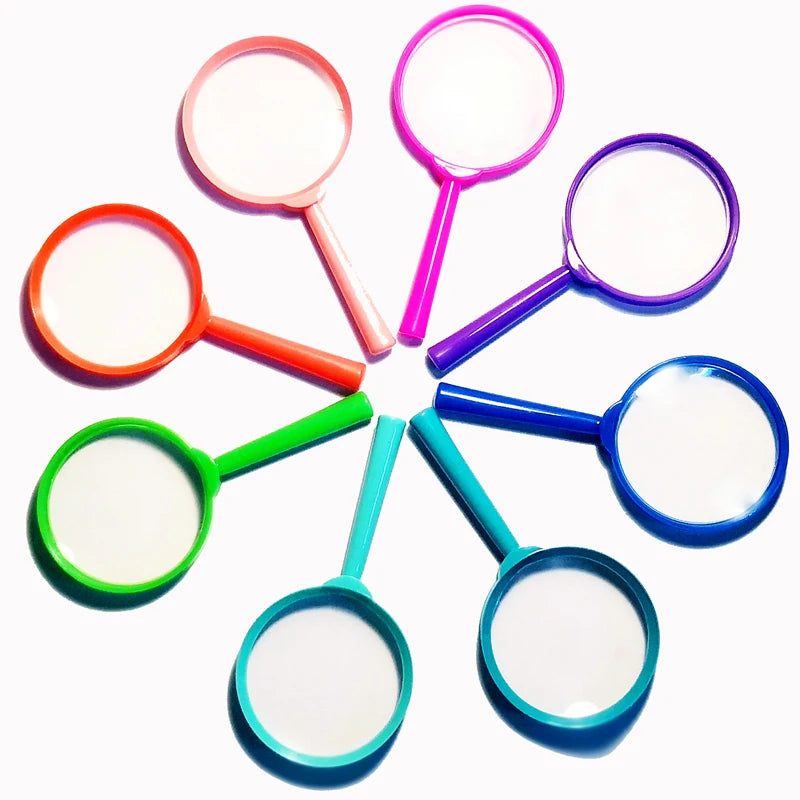 A collection of colorful plastic magnifying glasses with pink, purple, orange, and blue frames and white lenses.