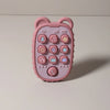 A pink phone-shaped silicone teether with various buttons and icons for babies.