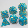 A set of marble dragon pattern polyhedral dice in various shapes and sizes with gold accents