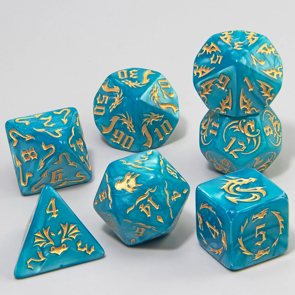 A set of marble dragon pattern polyhedral dice in various shapes and sizes with gold accents