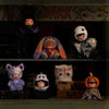 A collection of Hirono After Dark Series plush dolls and figures displayed in a glass cabinet.