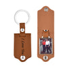 A brown leather keychain featuring a custom photo and engraved text I Love You.