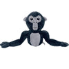 A dark gray and black plush toy of a monke gorilla with large eyes.