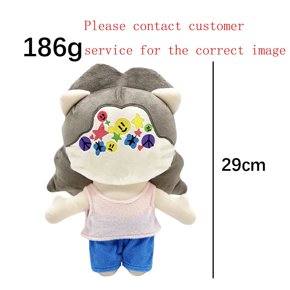 A plush doll featuring a collage of faces and symbols related to Eminem, XXXTentacion, and Frank Ocean.
