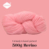 A ball of pink Merino wool yarn labeled Lirisnly, ready for knitting or spinning.