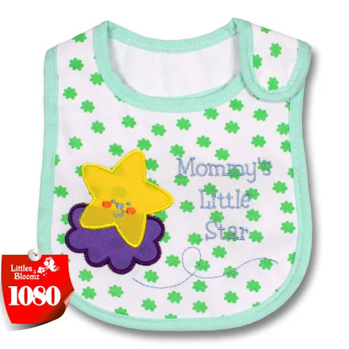 A white baby feeding bib with a yellow star design and green trim on a light green background.