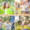 A collection of children playing outdoors with giant bubble wands and bubbles.