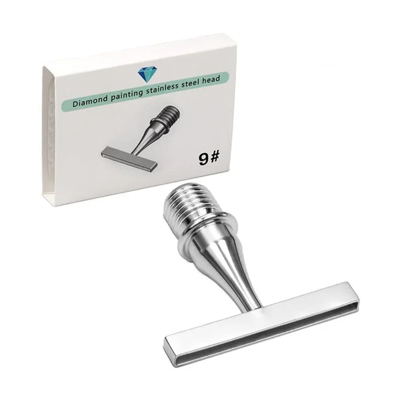 A diamond painting pen with a stainless steel head and a metal applicator shown next to its packaging.