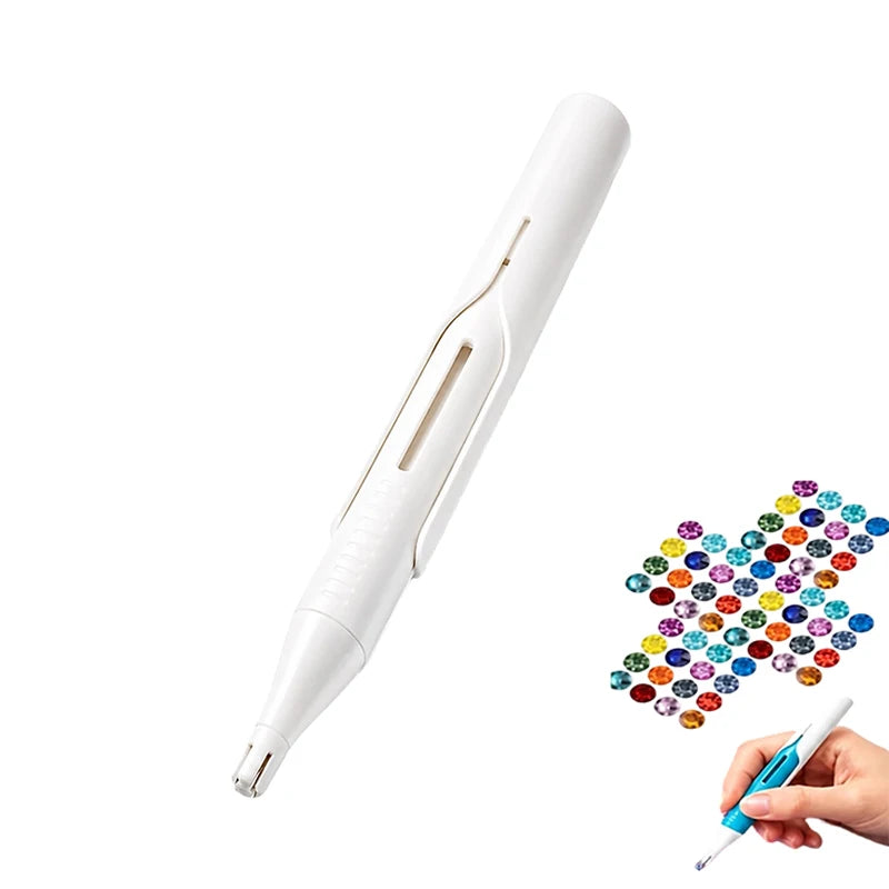 A white diamond painting pen with an automatic bead dispenser is shown next to a hand.