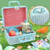 A blue and red picnic basket set with cups, food items, and accessories for a pretend play tea party.