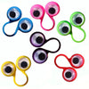 A collection of colorful wiggle eye finger rings used as sensory fidget toys or party favors.