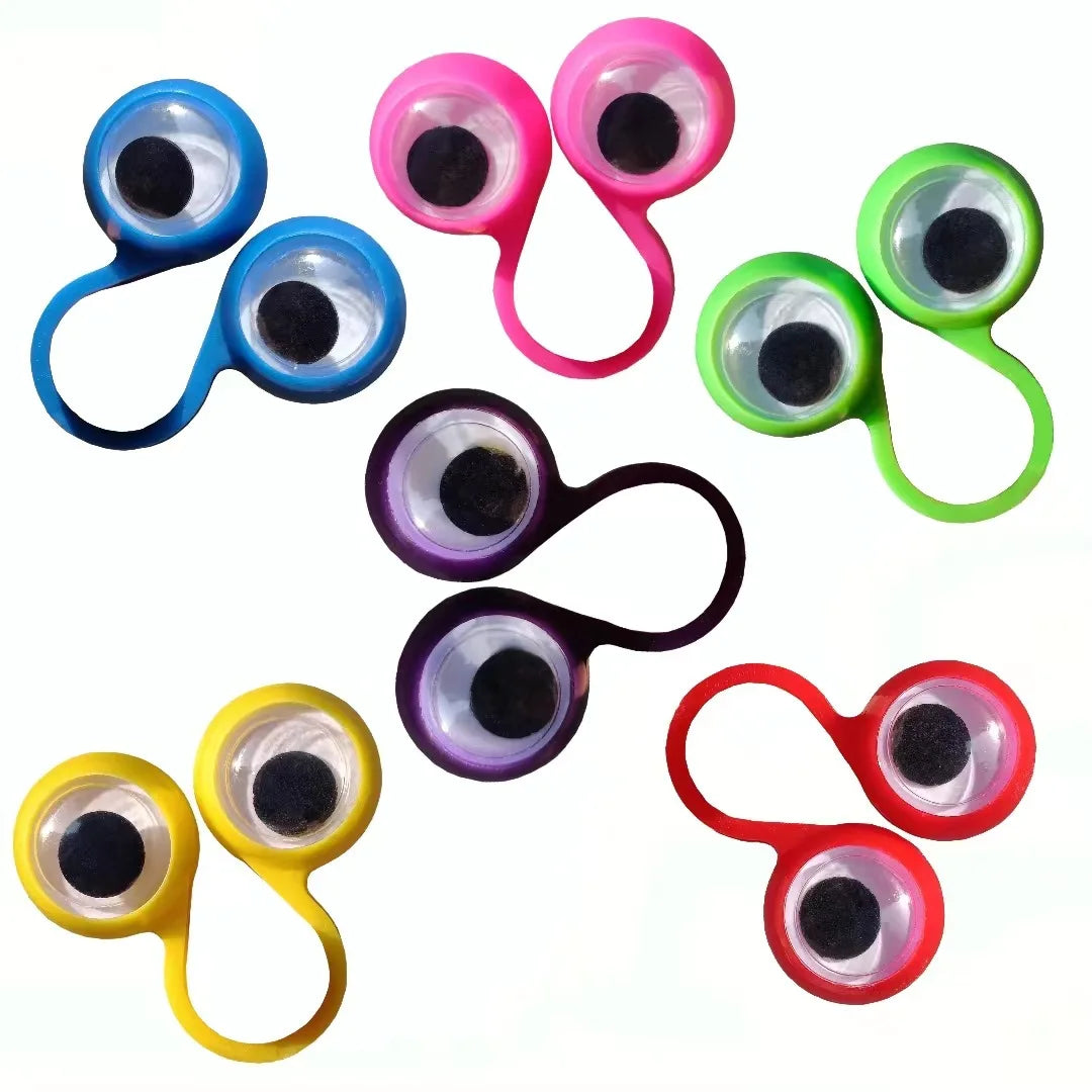 A collection of colorful wiggle eye finger rings used as sensory fidget toys or party favors.