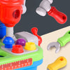 A set of kids' interactive toy drill and tool stand featuring red, white, and green components for play.