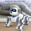 A white robot dog with blue eyes and eight wheels is shown sitting on a soft surface.