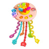 A pink Montessori sensory pull string toy for babies and toddlers with colorful pull strings.