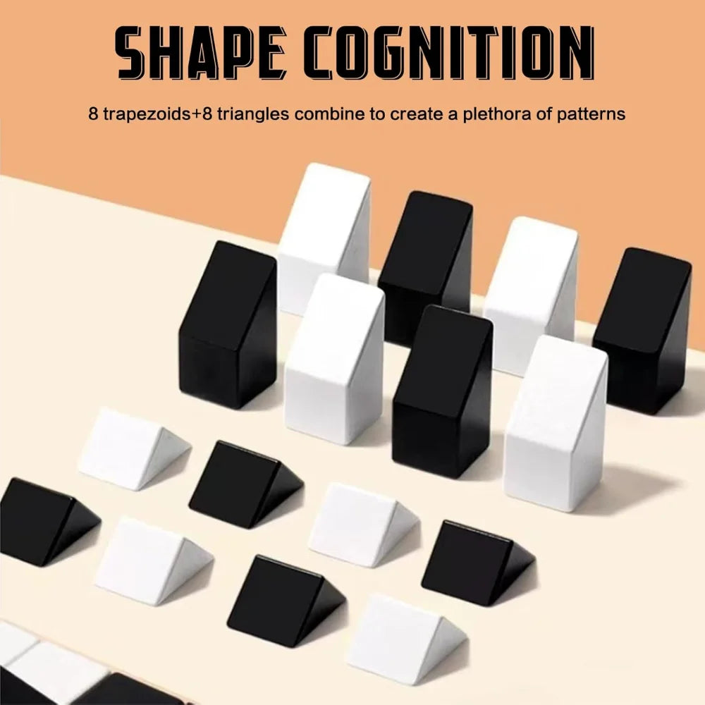 A collection of black and white geometric 3D blocks, including trapezoids and triangles, arranged on a light surface.