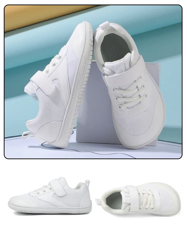 A pair of white minimalist barefoot sneakers shown from the side and top view.