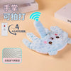 A light blue unicorn plush toy designed as a soothing pillow, shown with text indicating it can be touched and is suitable fo