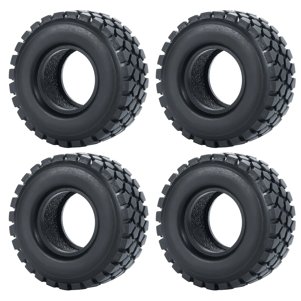 Quatre vues de roues en caoutchouc souple noir, conçues pour voitures RC crawler.