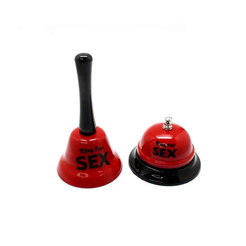 A red metal table bell with a black handle used for couples' games.