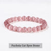 A bracelet made of pink quartz beads, resembling fuchsia cat eyes stone.