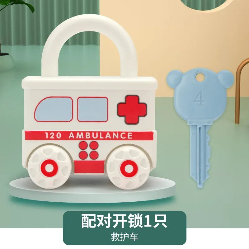 A white toy ambulance with a red cross and four wheels, accompanied by a blue key.
