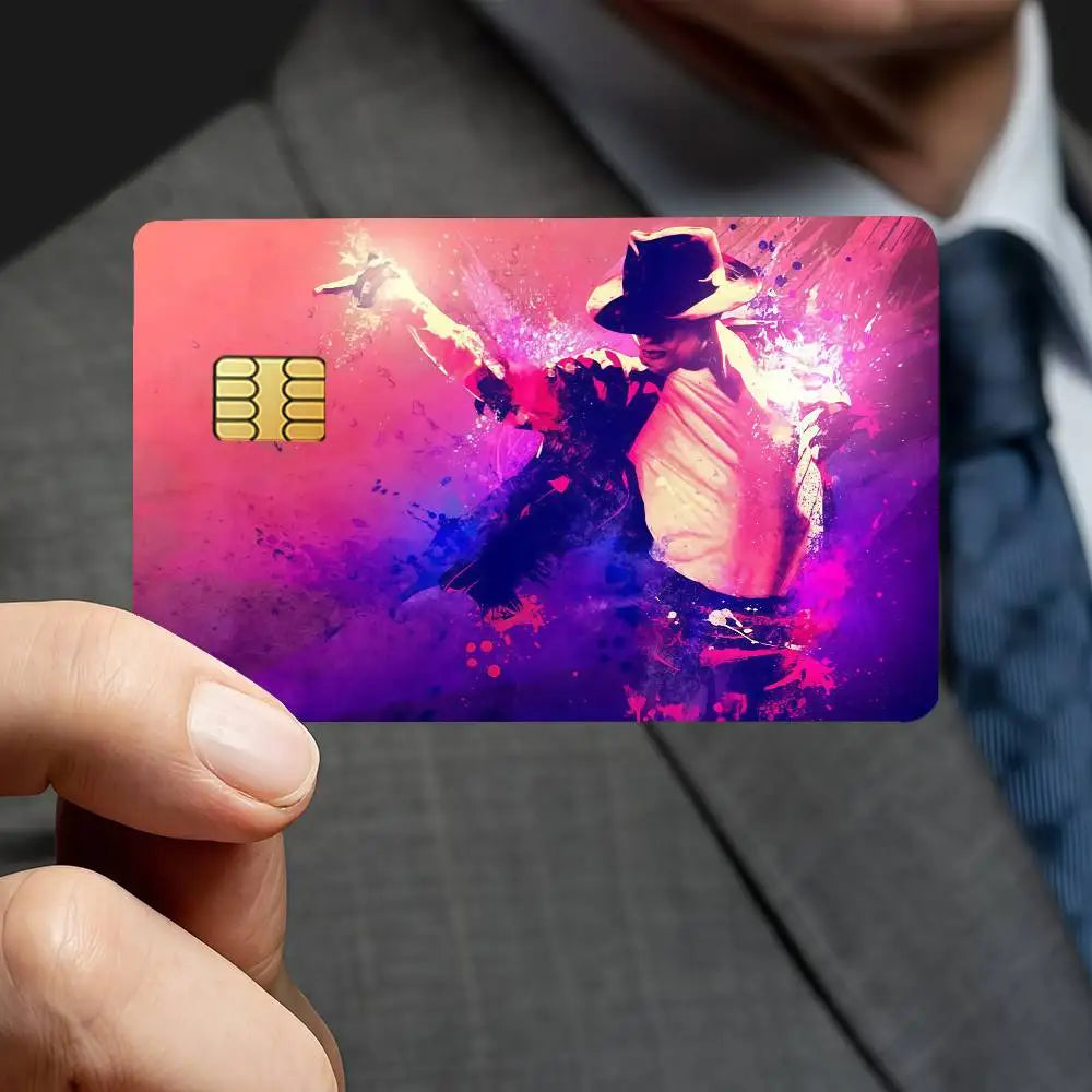A close-up of a credit card featuring a vibrant, artistic design inspired by Michael Jackson and purple and pink hues.