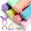 A collection of colorful chenille wire craft sticks and butterfly, bunny, and flower shapes.