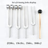 Set of four tuning forks displaying different frequencies: 128Hz, 136.1Hz, 256Hz, and 384Hz.