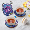 A set of mandala flower coasters featuring iridescent 5D diamond painting designs and butterfly accents on a white ceramic cu