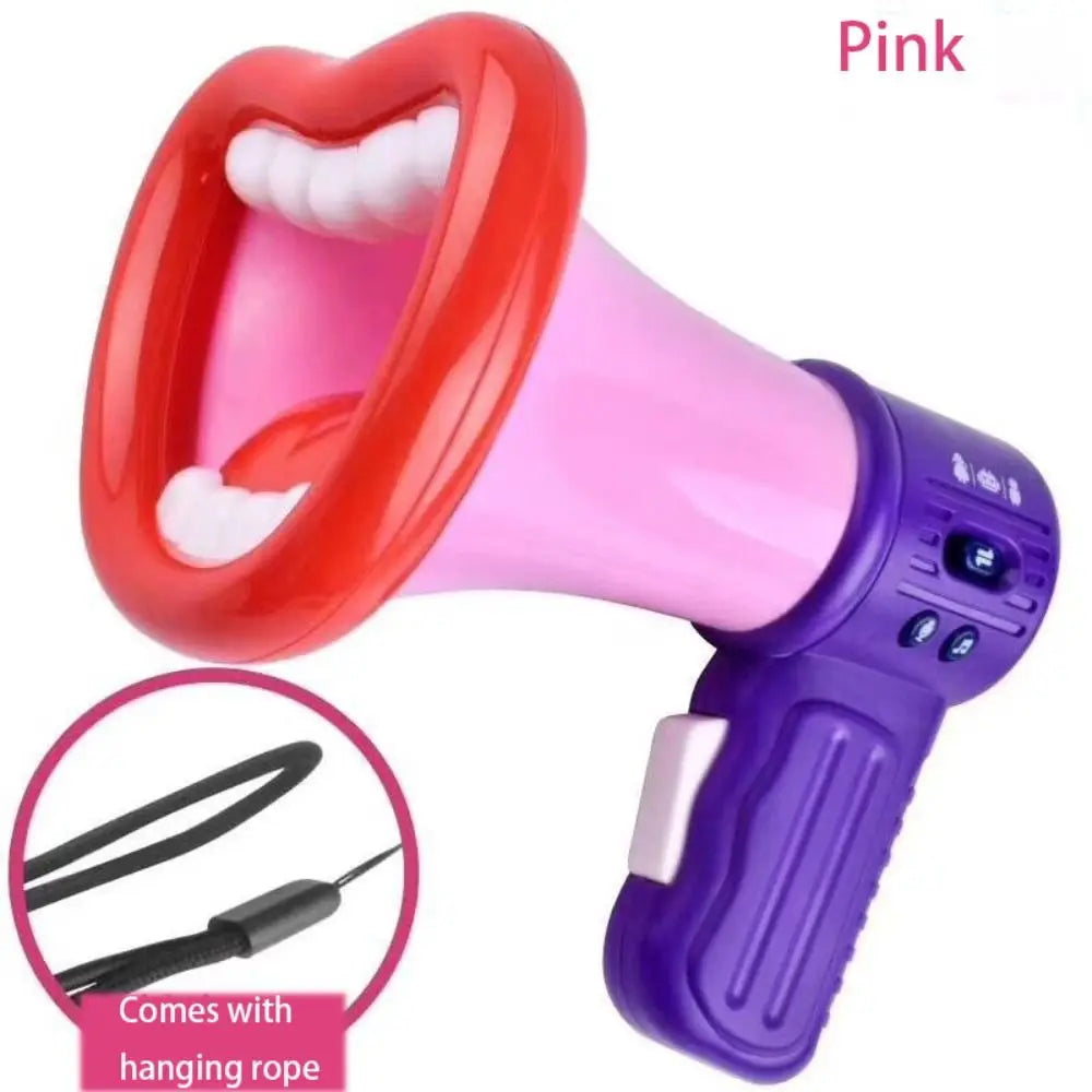 A pink megaphone toy with a red handle and purple body, shown next to a hanging rope.