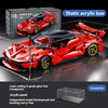 A red Super Car model built from acrylic blocks displayed on a glass surface.