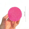 A hand holds a bright pink squishy ice ball fidget toy with a measurement line indicating 6cm or 2.36 inches.