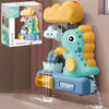 A yellow and blue dinosaur bath toy sprinkler is shown spraying water into a plastic basin.