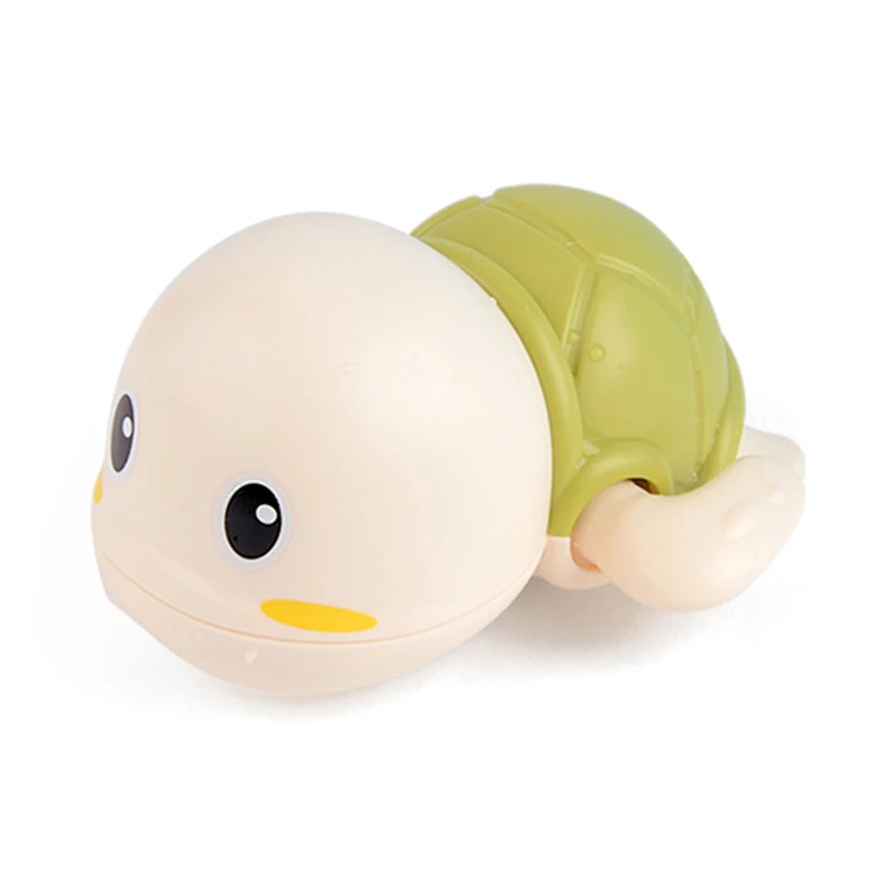 A light beige cartoon monkey shower toy with a green water sprinkler head.
