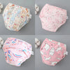 A set of four reusable cotton potty training pants for toddlers in pink and white patterns.