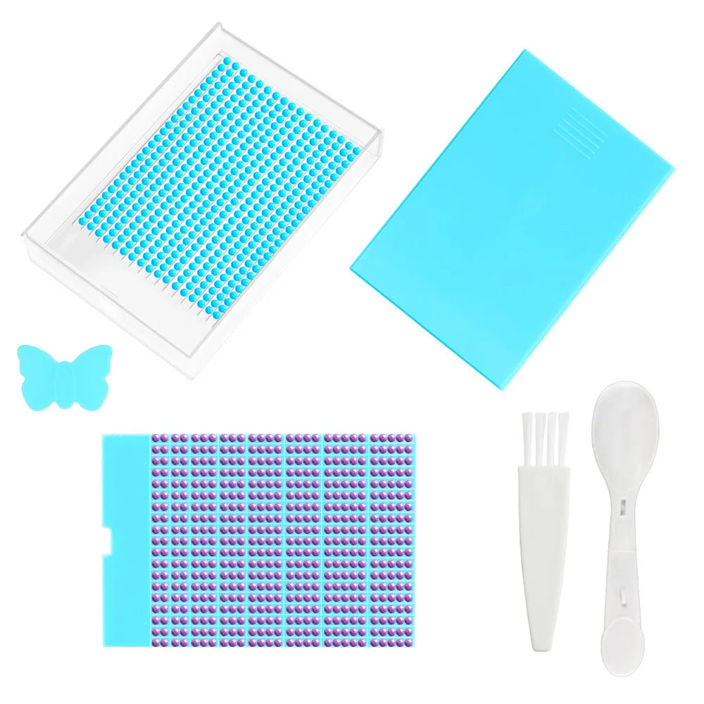 A clear diamond painting storage tray with a lid and a separate tray of purple beads is shown.