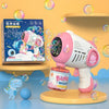 A pink automatic bubble machine toy is shown with a bottle and a round platform, surrounded by colorful bubbles.