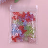 A clear plastic bag filled with 20 colorful acrylic bow beads in shades of red, pink, blue, and green.