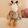 A plush toy resembling a baby giraffe with brown spots, white fur, and large ears.