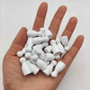A hand holds a set of ten white wooden chess pawns for board games.