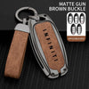 A matte gun brown buckle key case cover for Infiniti models shown with applicable keys.