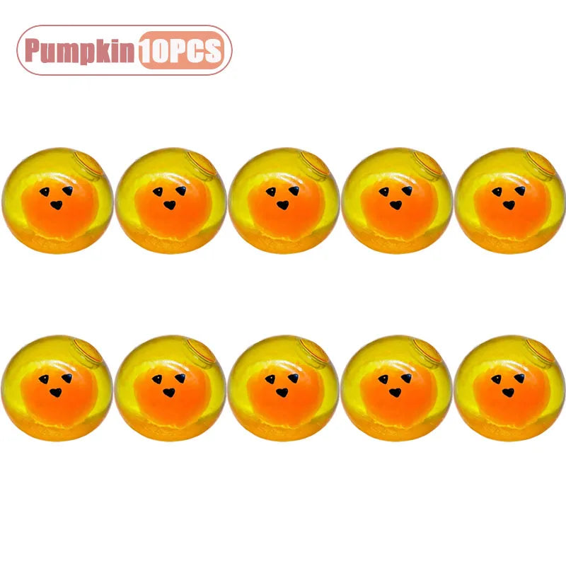 A set of ten orange pumpkin head squishy stress relief toys.