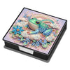 A leather diamond painting kit box featuring a colorful illustration of a green frog surrounded by floral and sparkling eleme