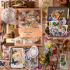 A collection of vintage stickers and paper crafting materials featuring butterflies, floral elements, and sepia tones.