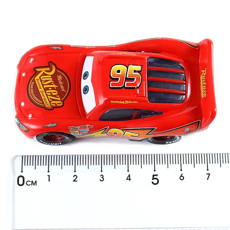 Red diecast toy hauler truck with the number 95 on the side