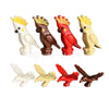 A set of six African wildlife animal building blocks in various colors including white, brown, and red.