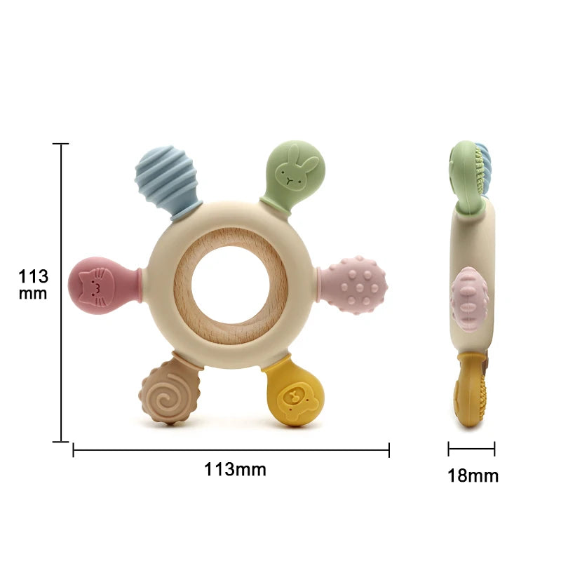 A silicone baby teether shaped like a rudder with a wooden ring and various attachments.