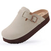A beige suede cork mule with a brown sole and a leather strap detail.